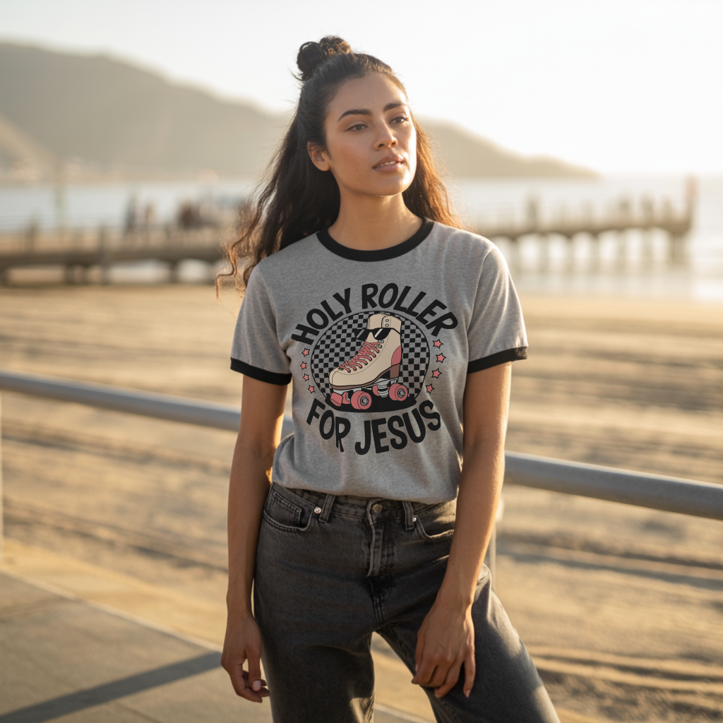Woman wearing Holy Roller for Jesus Salt and Light retro Christian unisex ringer t-shirt in Heather Gray on the beach — lifestyle photo by Salt and Light Merch.