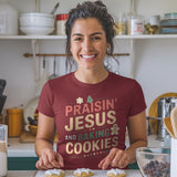 Praisin Jesus and Baking Cookies Christmas T-shirt woman wearing baking salt and light merch
