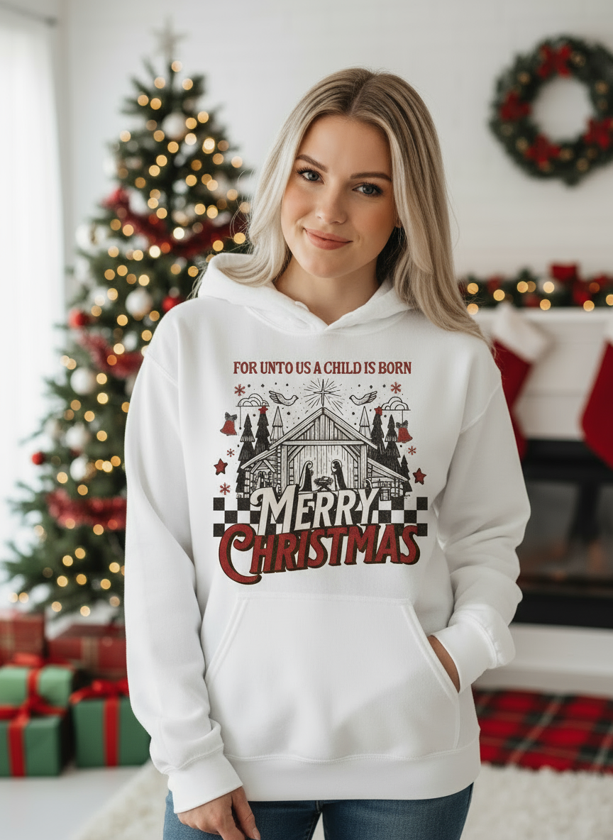 Salt and Light Merch female wearing a white hoodie with Christmas design in a indoor living room with decorated trees.