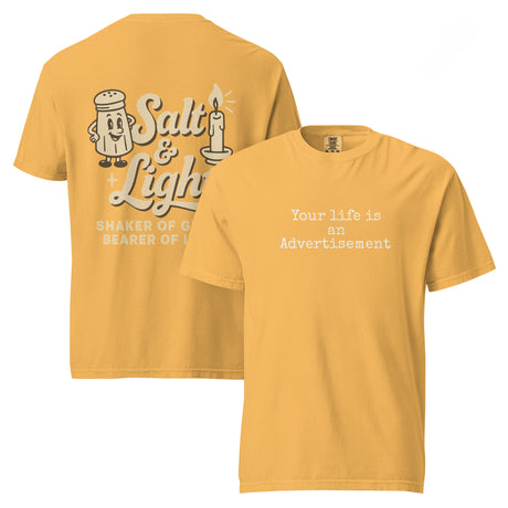 Double-sided mustard Comfort Colors Christian t-shirt showing ‘Your life is an Advertisement’ on the front and retro Salt & Light graphic with ‘Shaker of Grace, Bearer of Light’ on the back. Salt and Light Merch