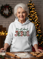 Salt and Light Merch Woman wearing a hoodie with 'It's all about Jesus' text in a festive setting.