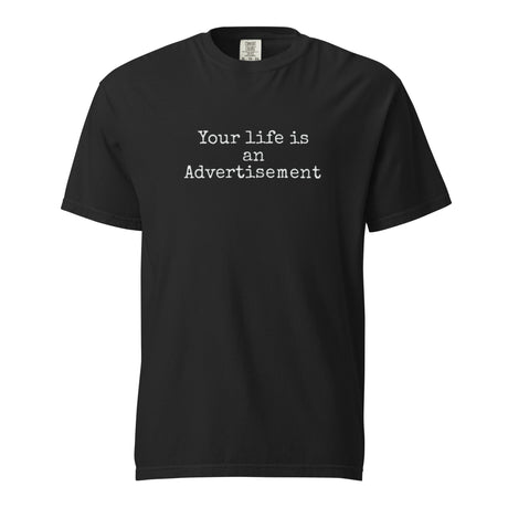 Black Comfort Colors Christian t-shirt with the phrase ‘Your life is an Advertisement’ in simple white typewriter font on the front. Salt and Light Merch